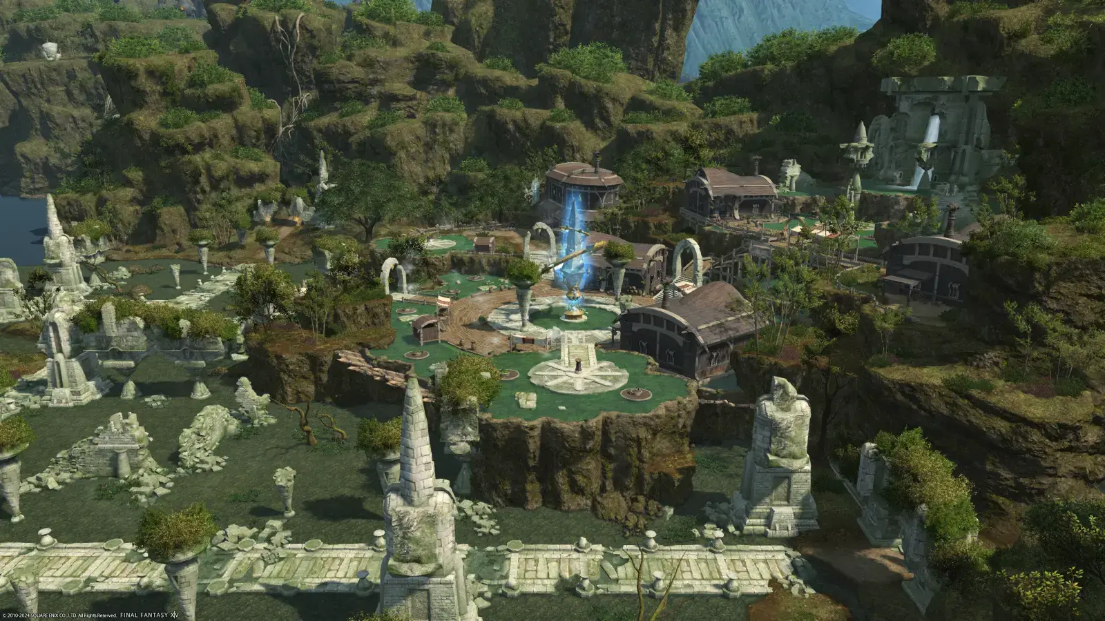 Flying shot of the hot spring of Camp Bronze Lake. The ruined pathways show a visible path to the springs entrance, which is surrounded with lush green mountain tops, with the shining Aetheryte at the centre.